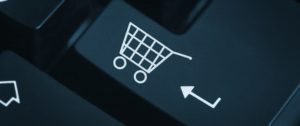 The Image Showing the representation of a keyboard having a symbol of ecommerce cart to show the new trends in eCommerce Industry